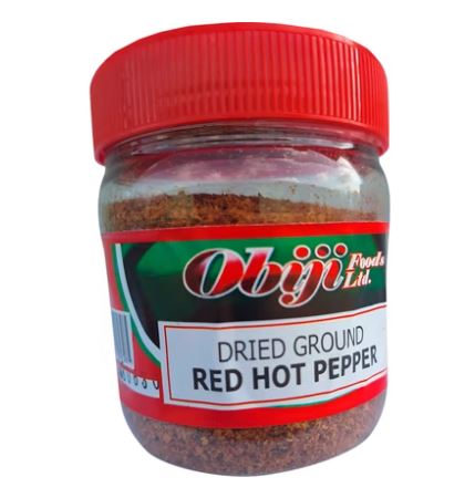 Obiji Dried Ground Red Hot Pepper 112g in a transparent plastic jar with red lid, authentic Nigerian crushed Tatashe pepper for African soups, stews and jollof rice, available at AfroFresh Poland.
Copy alt text